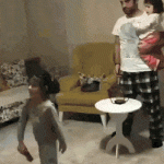 Dad playing with his daughters