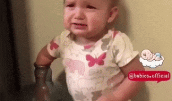 Girl puts hand in water bottle