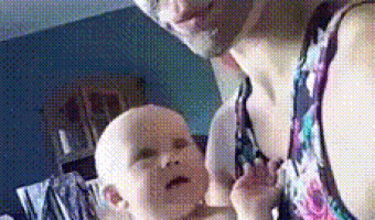 Scared son with mother’s mask