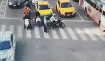 Motorcyclist helps old man to cross the street
